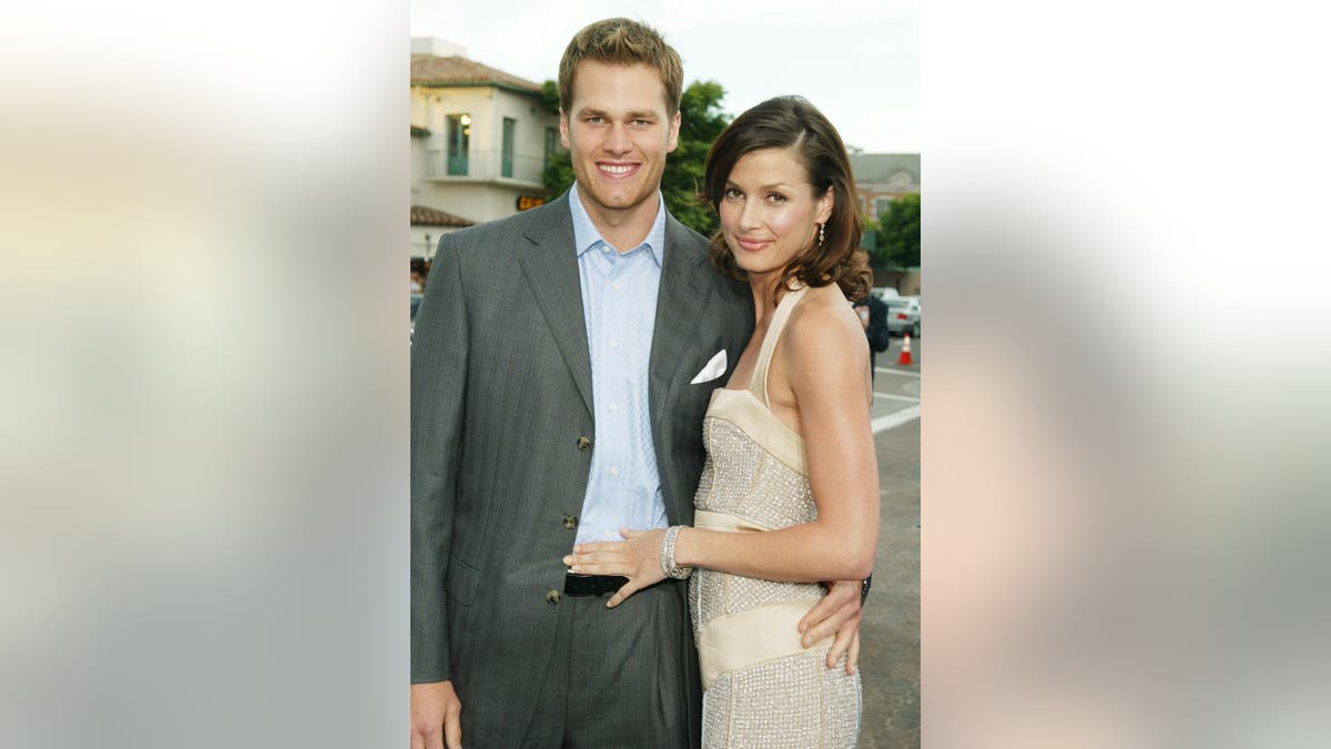 NFL quarterback Tom Brady and actress Bridget Moynahan standing at the premiere event