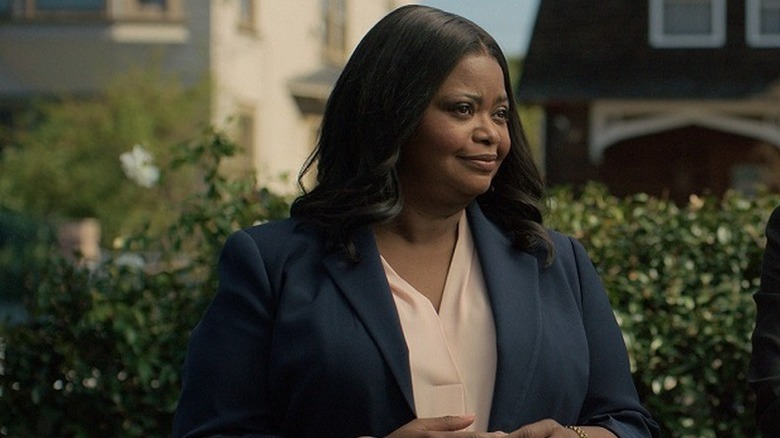 Poppy Parnell (Octavia Spencer) stands by a bush in Truth Be Told