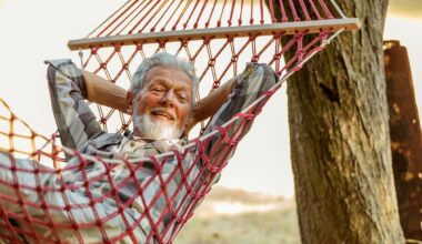 Someone is in a hammock, smiling.