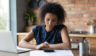 Adult looking at financial paperwork.