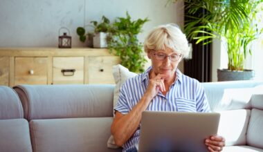 A person on a couch using a laptop.
