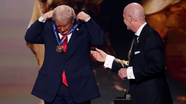 US President Donald Trump receives the FIFA Peace Prize from Gianni Infantino, President of FIFA, during the FIFA World Cup 2026 Official Draw at John F. Kennedy Center for the Performing Arts on December 05, 2025 in Washington, DC.