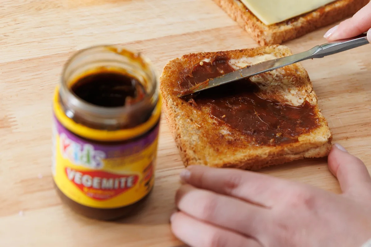 Aussies divided as Vegemite's first new product in six years hits Coles and Woolworths