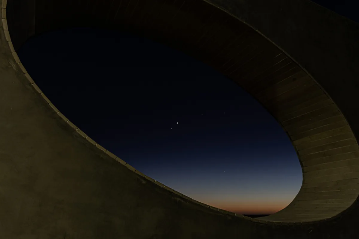 João Miguel Santo captured this artistic image of Venus and Jupiter from Chão das Pias Viewpoint (Miradouro do Chão das Pias), Porto de Mós, Portugal, 9 June 2026. João says: "This photograph captures the closest apparent approach of the year between Venus and Jupiter, reaching a minimum angular distance of 1.6 degrees. "The planetary conjunction is framed through the architectural oval structure of the Chão das Pias viewpoint during twilight." Equipment: Canos R6 MKII DSLR camera, RF 24-105 F4 lens Exposure: ISO 320, 24mm f/5.6, 1s Software: Adobe Lightroom #venus #jupiter #venusjupiter #stargazing #astrophotography