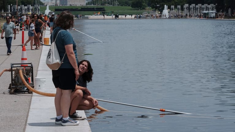 Visitors look at the Lincoln Memorial Reflecting Pool Sunday, June 21, 2026, on the National Mall in Washington.
