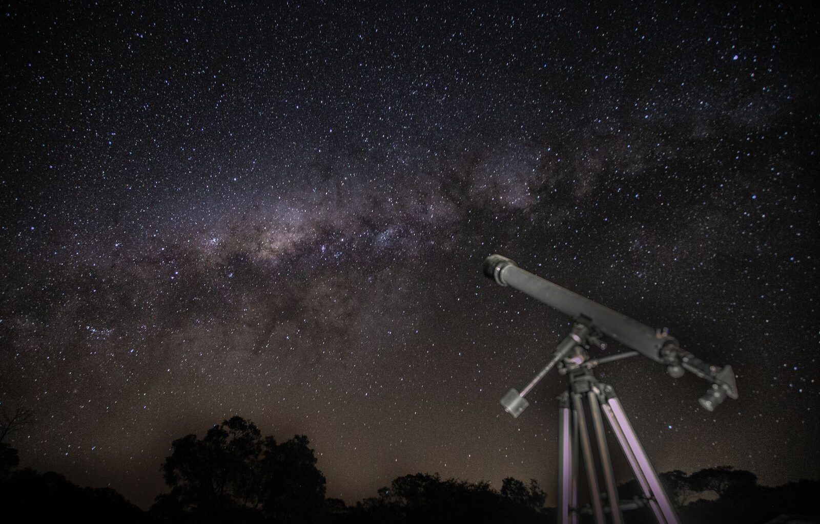 When JWST looked at XLSSC 122, a galaxy cluster 10.4 billion light-years away, it caught gravity bending light from galaxies about 12 billion years in the past, and a dark matter core packed too tightly for cosmic noon