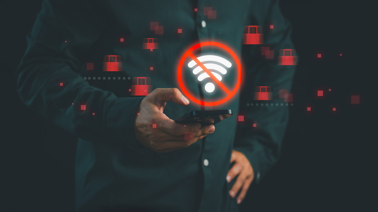 concept, man holding smartphone with no wi-fi