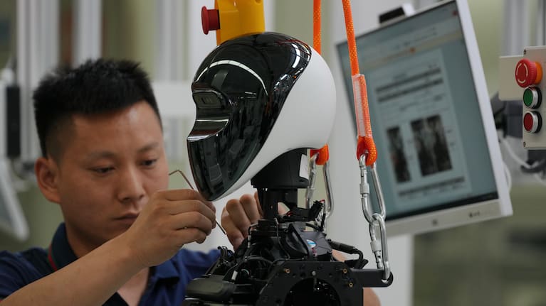Workers assemble robots LY iTech Beijing Super Factory for Embodied Artificial Intelligence.