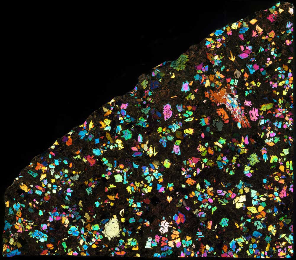 A kaleidoscope of colors is seen against a black background