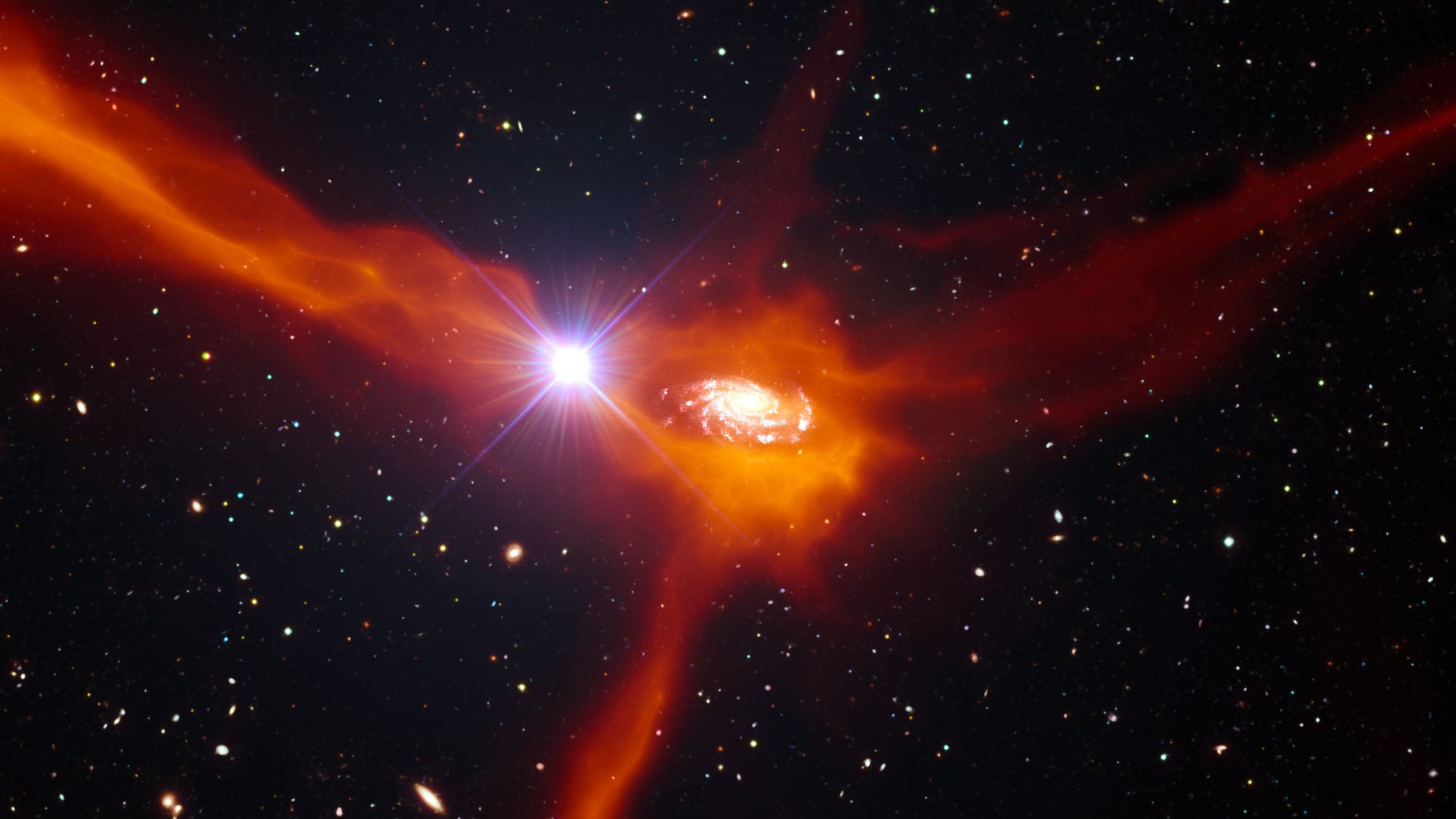 a red swirl of gas with a central white spiral on a black starry background