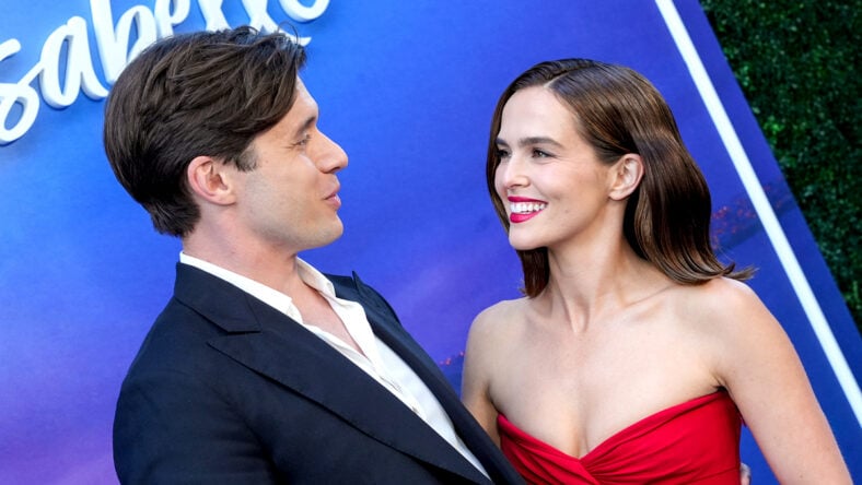 Zoey Deutch and Nick Robinson on red carpet at Voicemails for Isabelle premiere