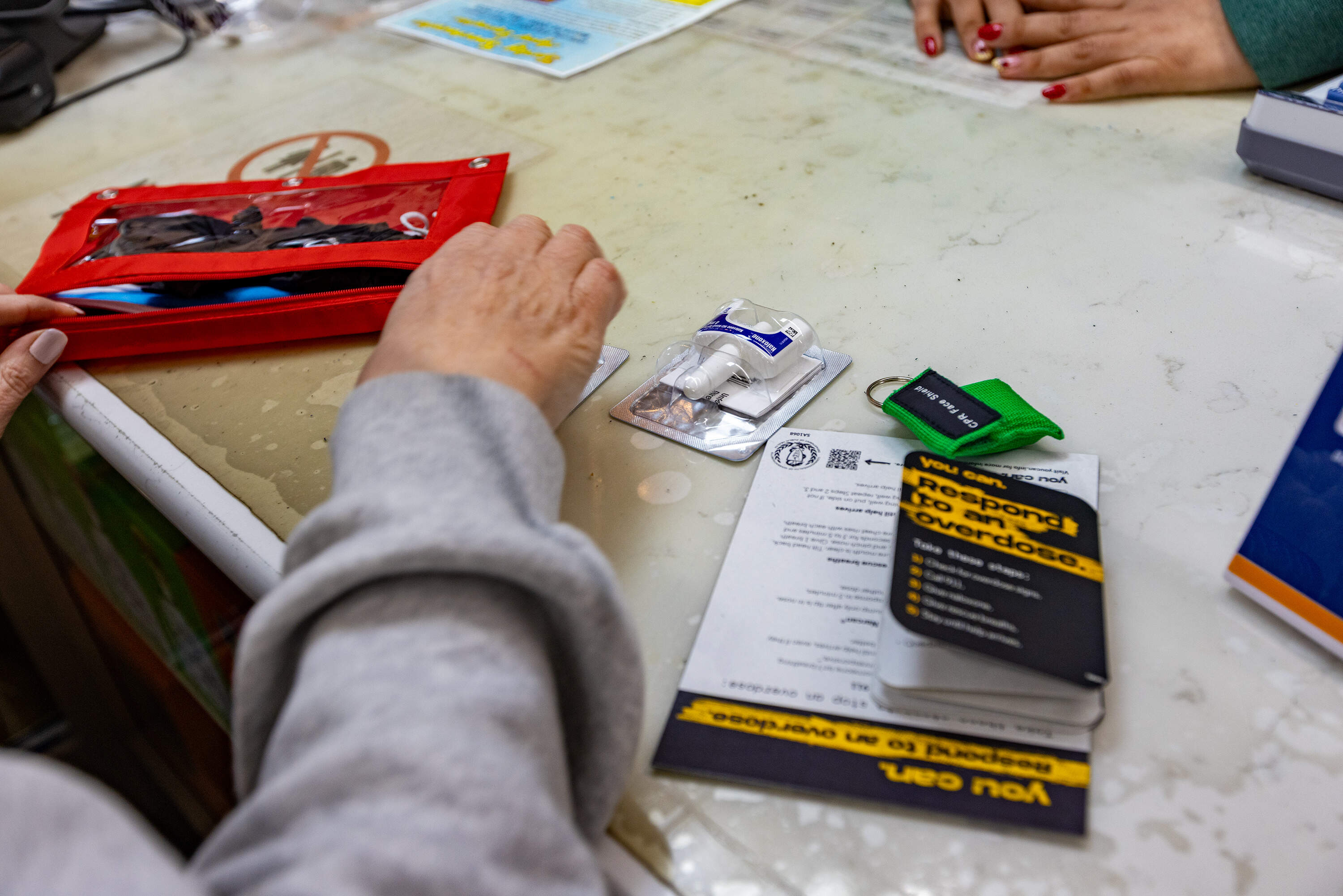 Revere businesses that undergo the training receive small kits with two naloxone doses, instructions, medical masks and gloves. (Jesse Costa/WBUR)