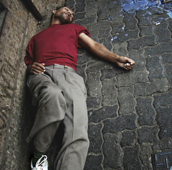 A man lying on a pavement, depicting patients who tried to outsmart their doctors and failed.