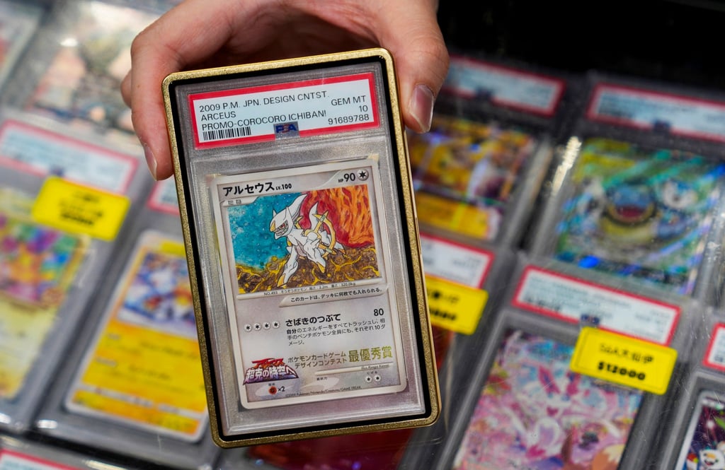 A seller shows a Pokemon card worth about US$64,000 at the Hong Kong Trading Card Show on March 14. Photo: Elson Li