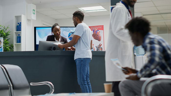 A patient at a reception desk, representing patients who tried to outsmart their doctors and failed.