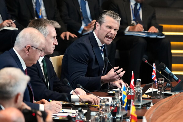 United States Defense Secretary Pete Hegseth, right, speaks during a meeting of the North Atlantic Council in defense ministers format at NATO headquarters in Brussels, Thursday, June 18, 2026. (AP Photo/Virginia Mayo)