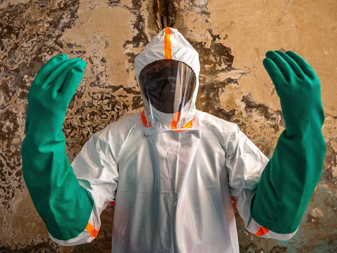 "Portrait of a DPS (Provincial Health Division) agent taken during the disinfection of the Clinique Universelle, which recorded a fatal Ebola case on its premises. Clinique Universelle, Bunia, Ituri, DR Congo, June 13, 2026."