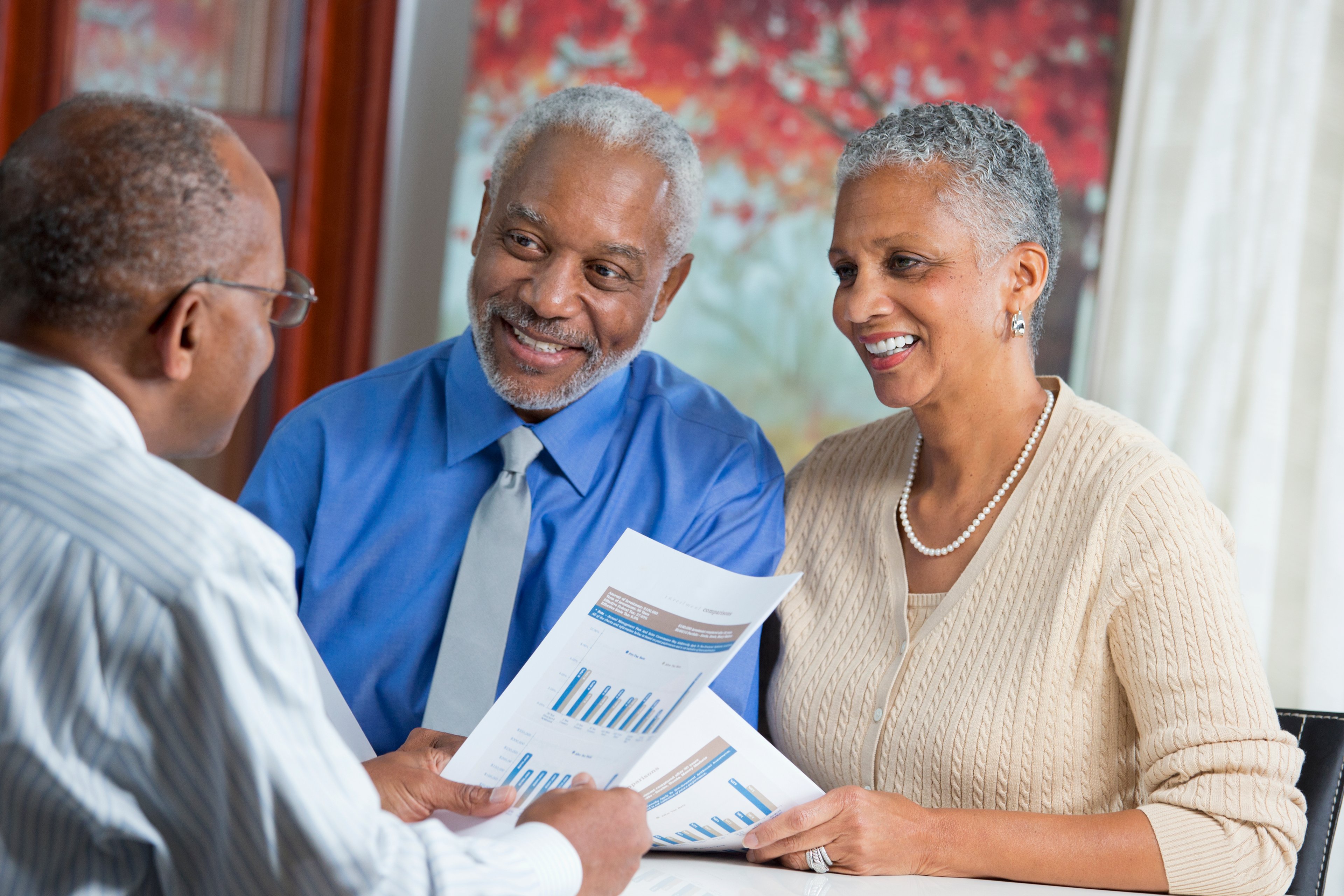 Adult looking at financial paperwork.