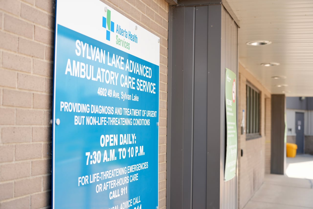 A timing signboard of a health clinic, open from 7:30am to 10pm.