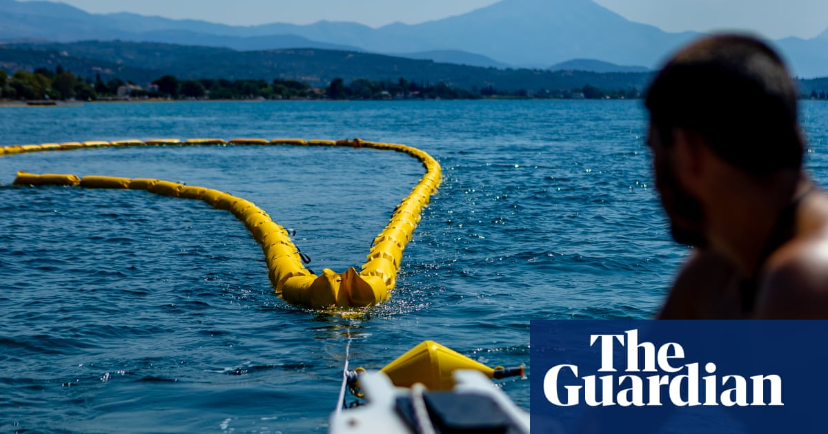 ‘Better safe than sorry’: Greece installs floating barrier to ward off toxic fish | Greece