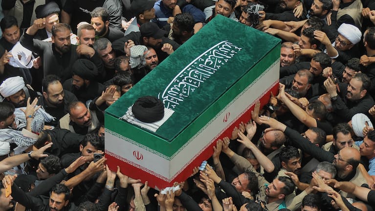 The coffin of the late Iranian Supreme Leader Ayatollah Ali Khamenei is carried by mourners to the Imam Ali Shrine in Najaf, Iraq, Wednesday, July 8, 2026.