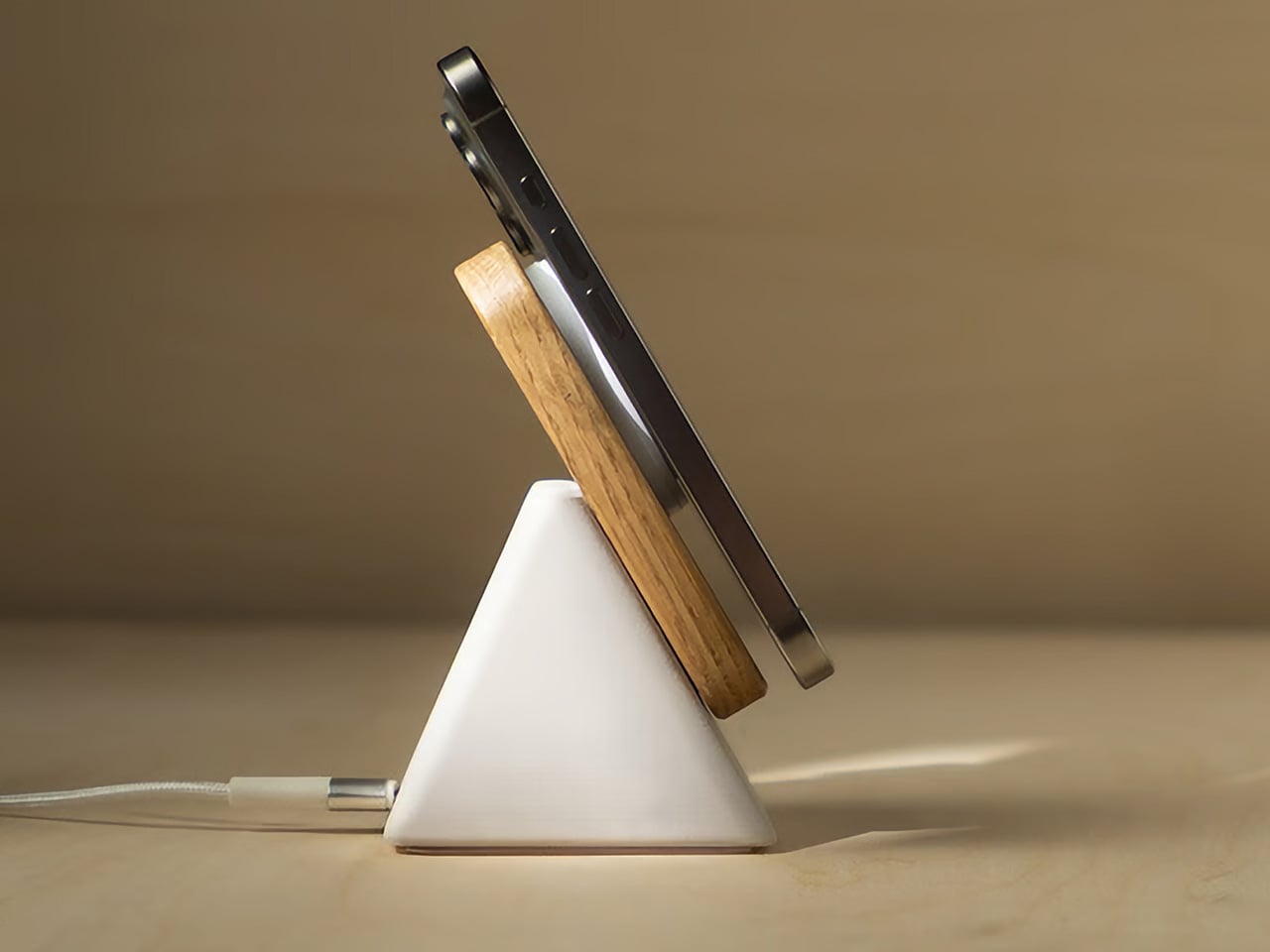 I’m tired of ugly chargers, this concrete and wood 25W Qi2 charger looks gorgeously sculptural