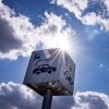 A sign offers parking and charging facilities for electric cars at a retail park in Berlin in 2023. Evidence from the oldest generation of electric vehicles suggests their batteries are lasting longer than was expected in the early days of the EV industry.