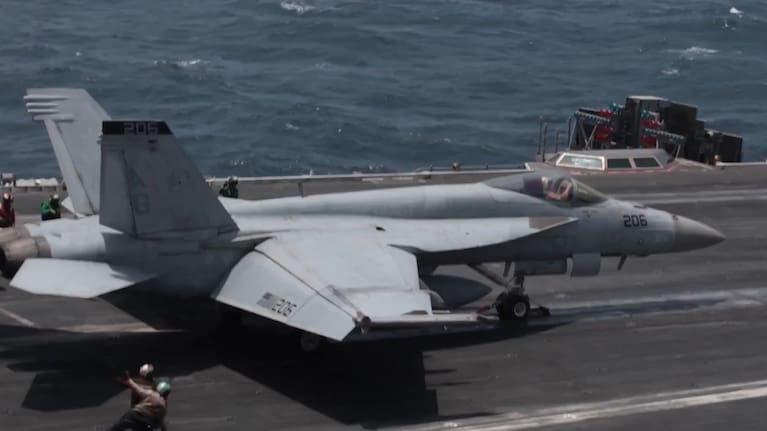 The US Navy conducts flight operations on the USS George H.W. Bush.