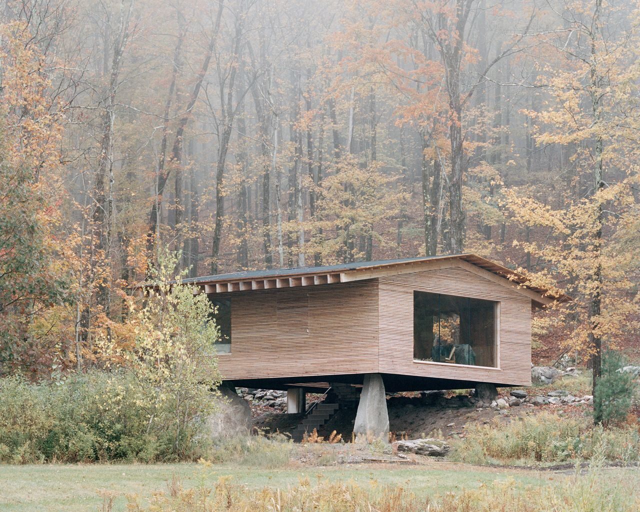 500-Million-Year-Old Boulders Prop Up This Small Cabin in New York