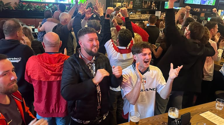 England fans in Auckland celebrate Anthony Gordon's goal against Argentina.  