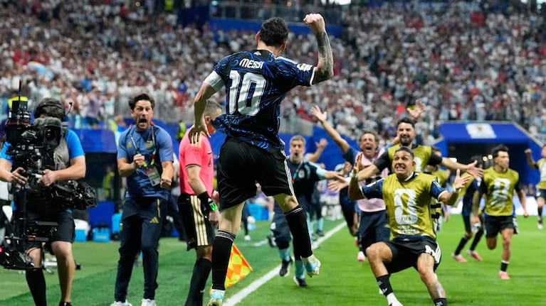 Argentina's Lionel Messi celebrates after teammate Lautaro Martinez scored their side's second goal during the World Cup semifinal match between England and Argentina in Atlanta. 