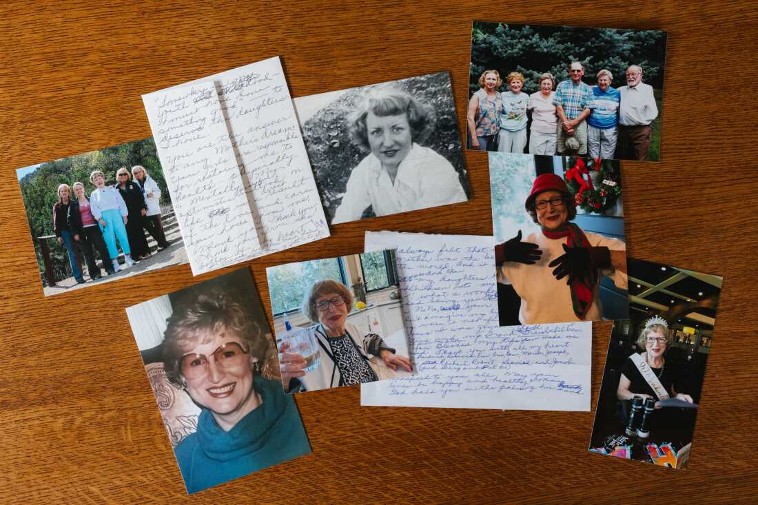 Photographs of Gladys Lynch at different points in her life are arrayed on a table, along with letters.