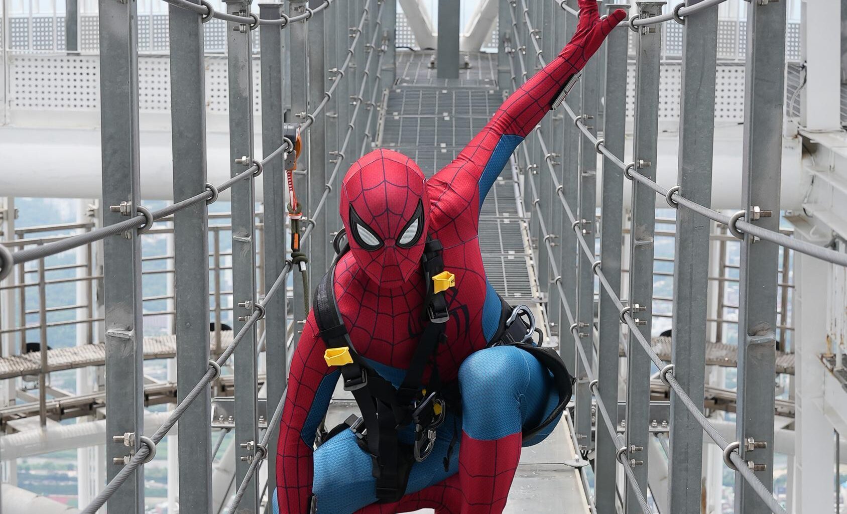 An actor dressed as Spider-Man explores themed photo zones and takes on the Sky Bridge Tour atop Lotte World Tower in Seoul to promote Sony Pictures’ “Spider-Man: Brand New Day.” Courtesy of Lotte World