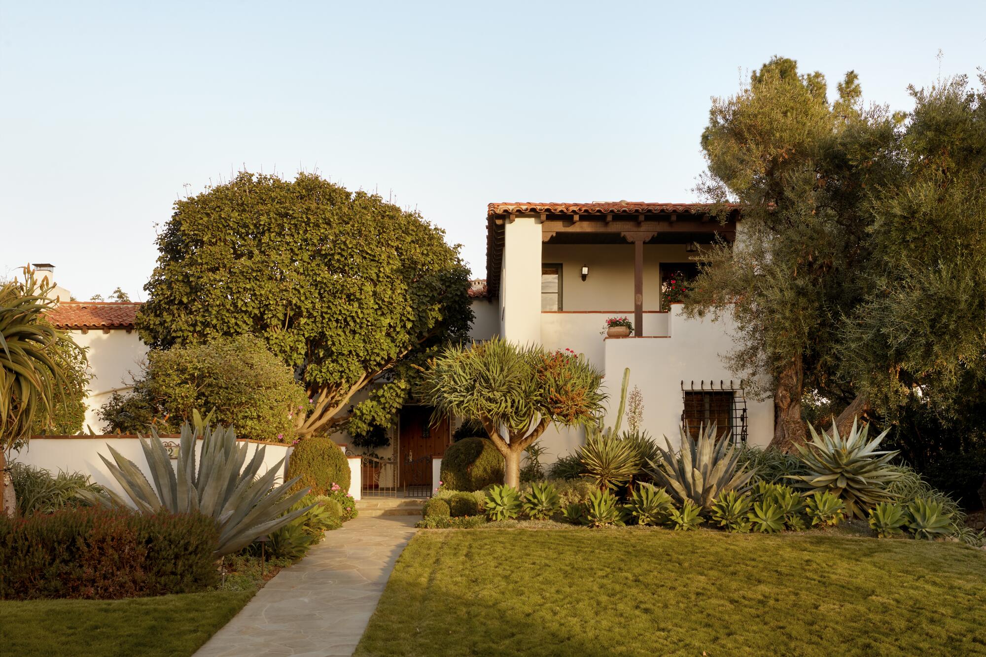 The Lauensteins' front entry is shaded by a coral tree that the couple craned in.