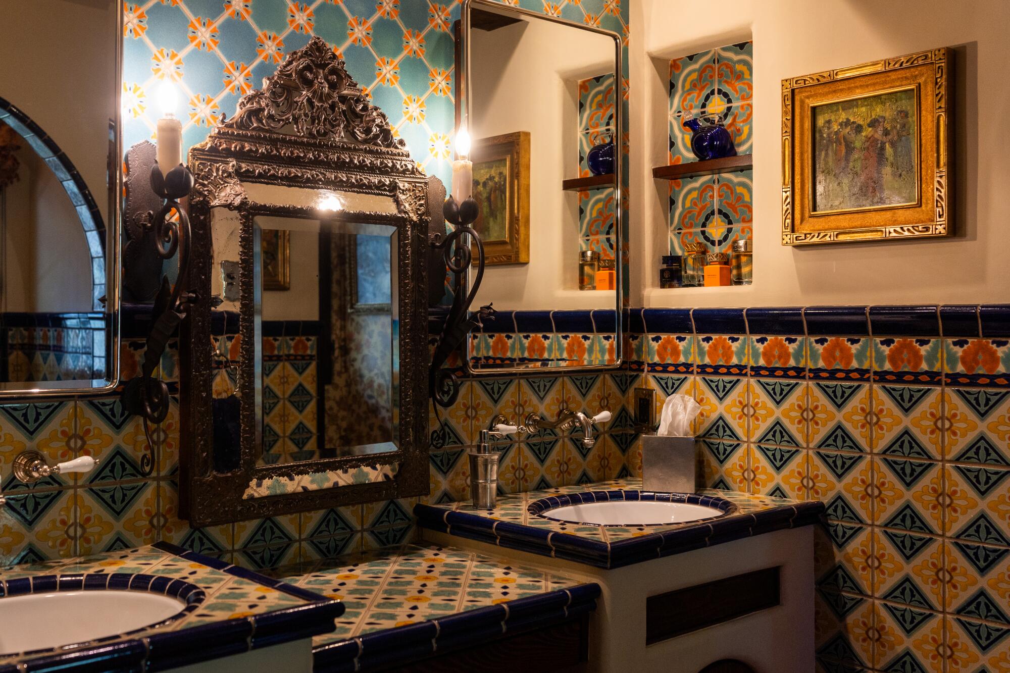 The primary bathroom reflects the 1920s fervor for vivid tile work.