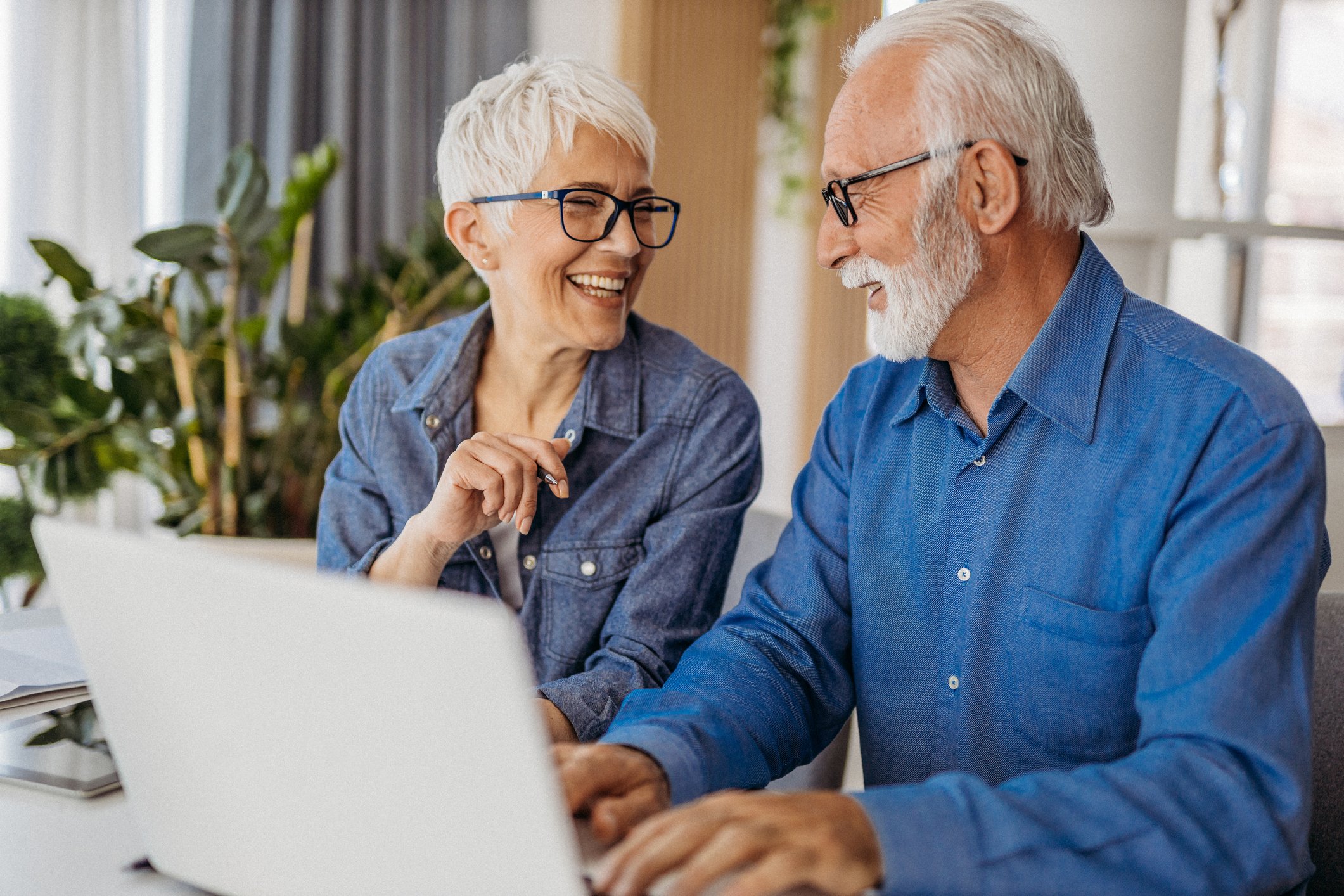 Two people at a laptop.