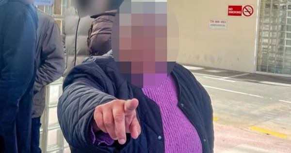 Woman with prominent sportsperson facing charges shoves reporter outside court