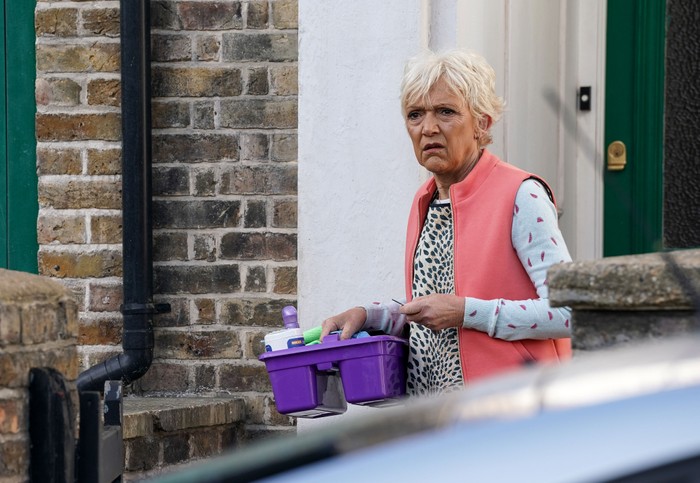521560,TITLE:EastEnders Jean with her cleaning equipment in EastEnders