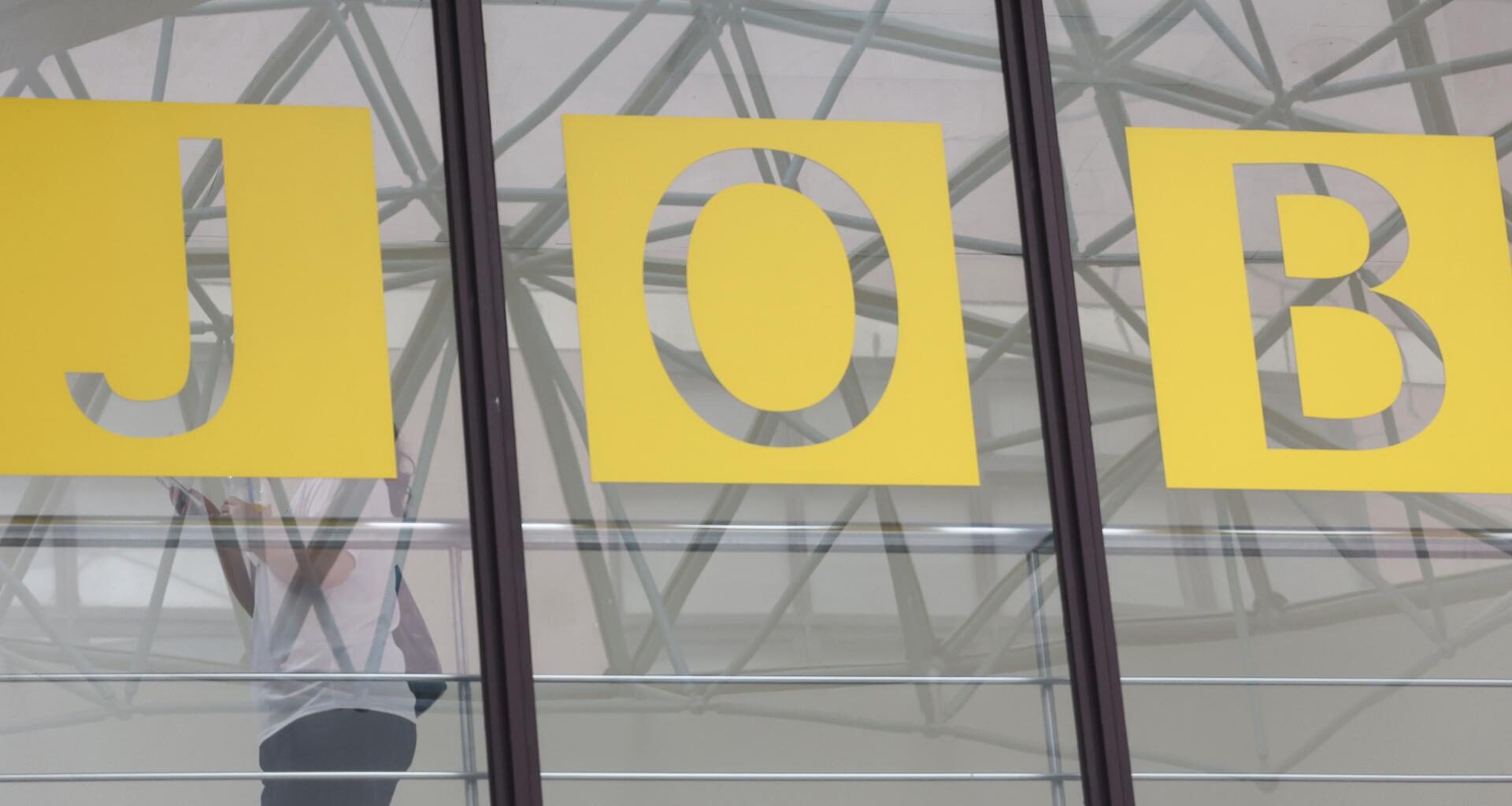 A student walks past a sign at an employment center at a university in Seoul, Thursday. Yonhap