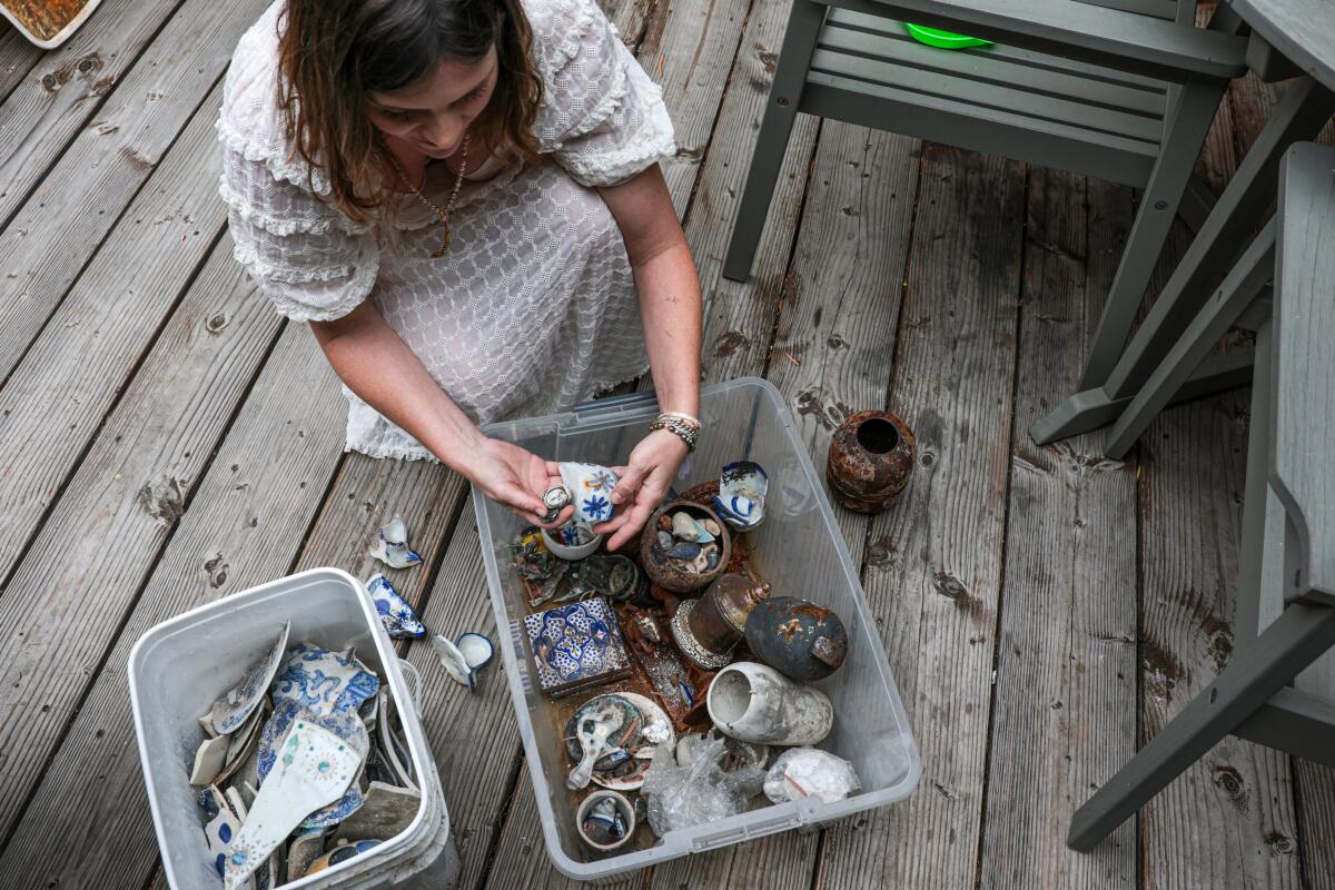 At her home in Silver Lake, Chelsea Bayouth shares some of the porcelain figures she recovered from the Eaton fire.