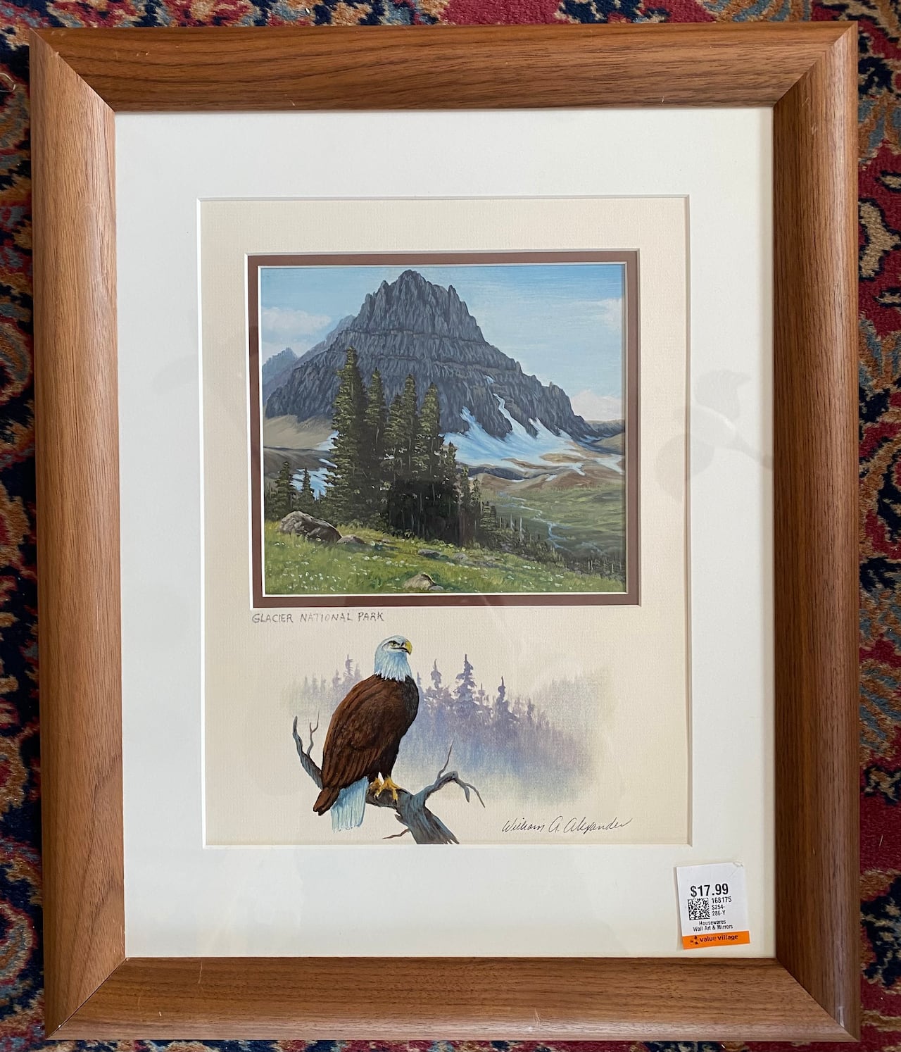 Framed realistic painting of a mountain landscape. The frame mat has been hand painted with a picture of a bald eagle.
