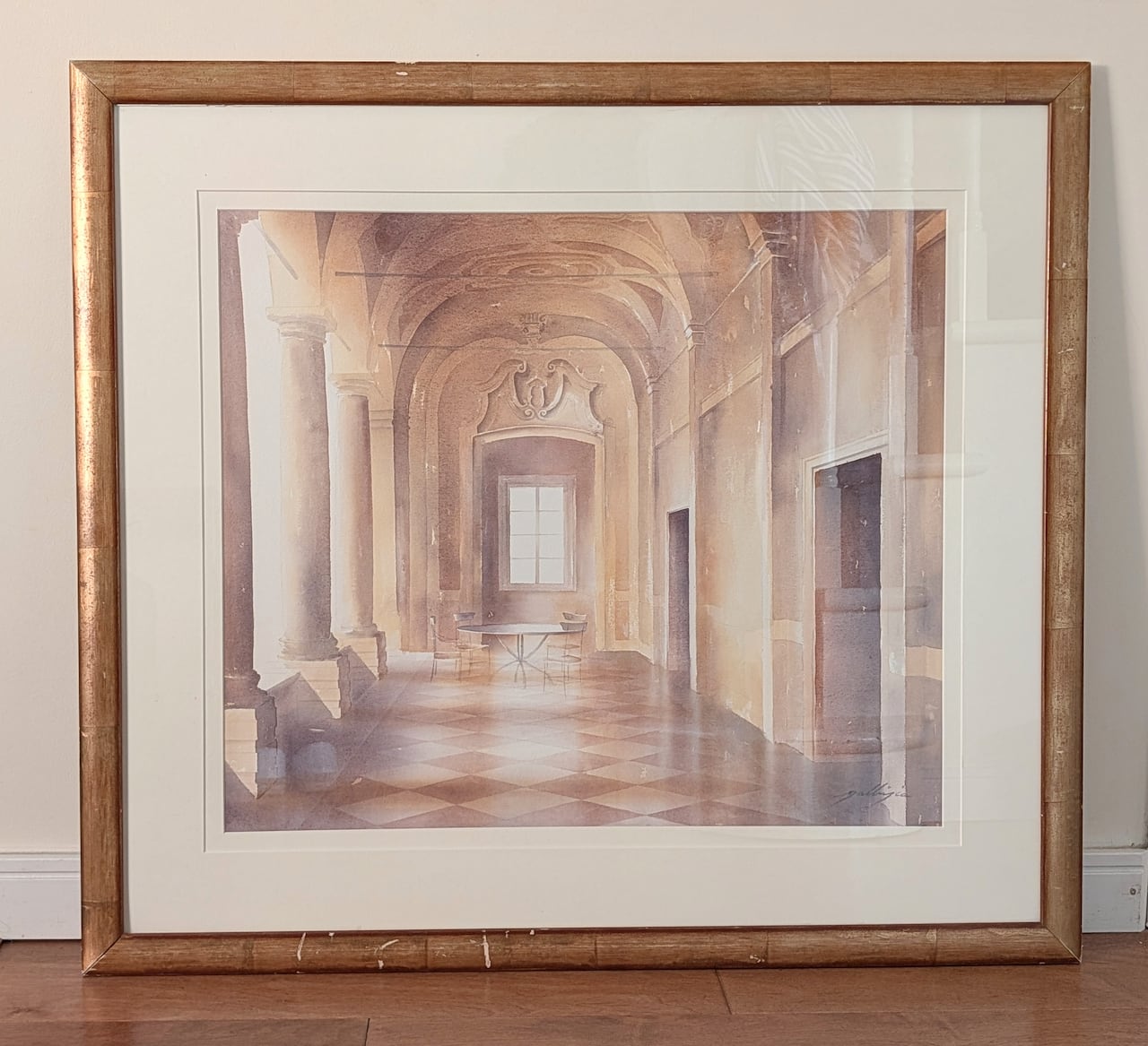 Watercolour of an interior scene in a gold frame.