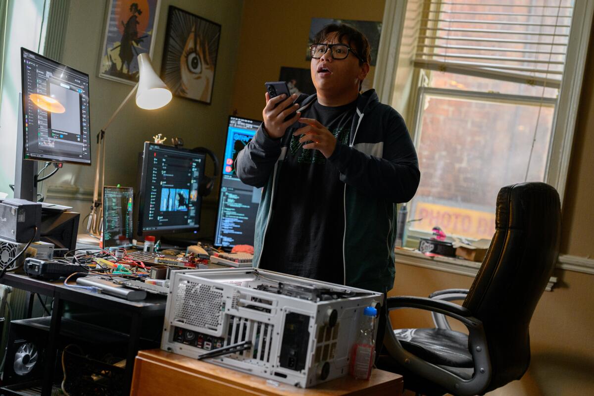 Ned (Jacob Batalon) standing by his computer