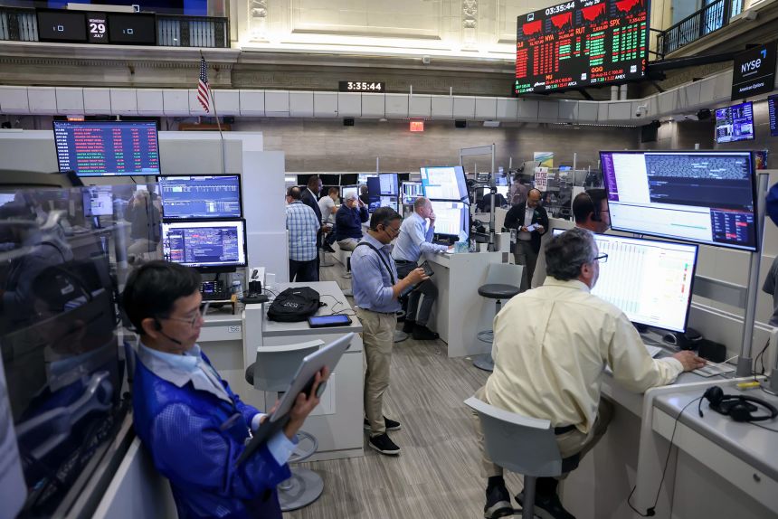 Traders work at the New York Stock Exchange after a Federal Open Market Committee meeting on July 29, 2026.