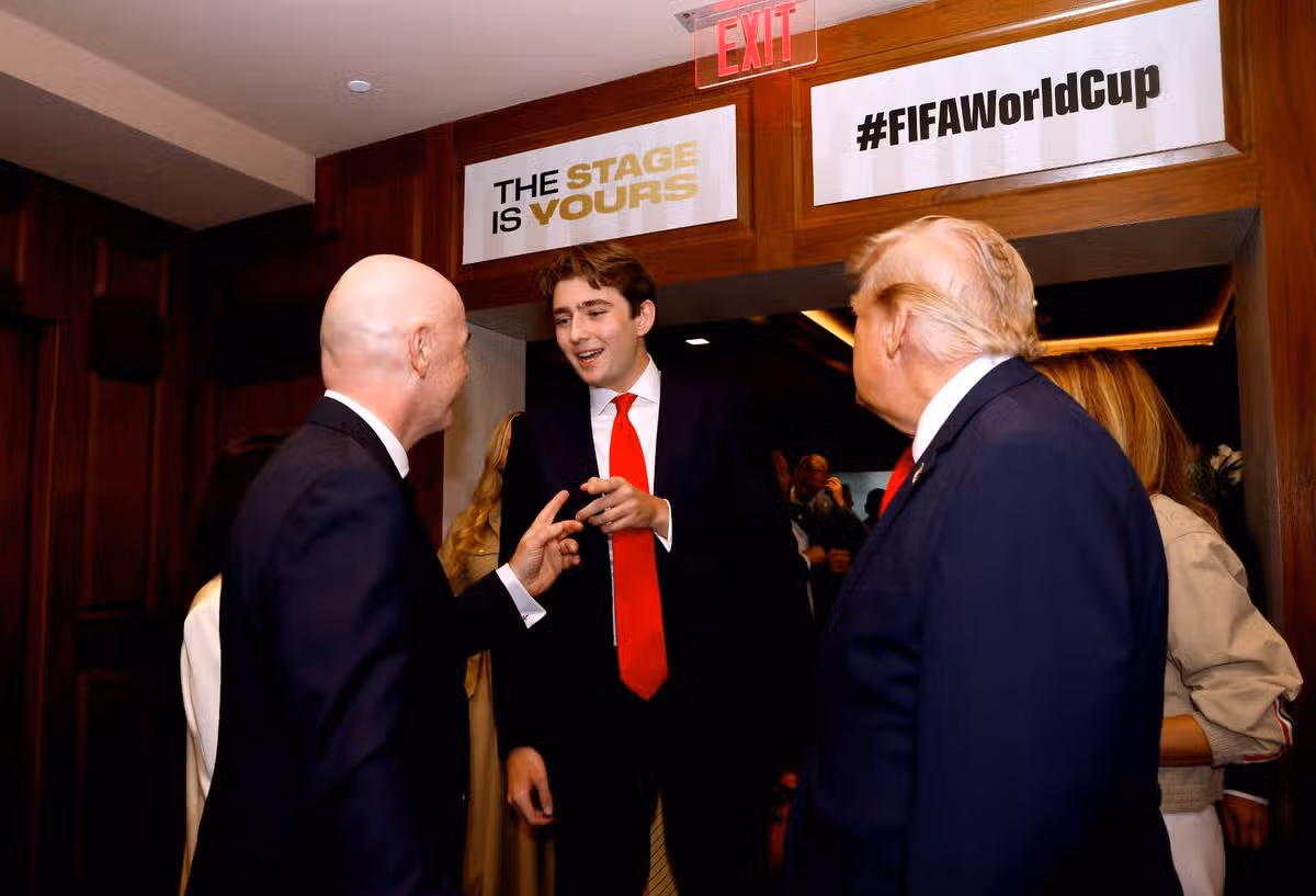 Barron Trump, U.S. President Donald Trump, and FIFA President Gianni Infantino attend the FIFA World Cup