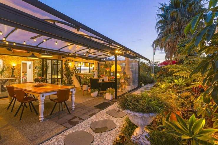Terry Fergusson-Hughes, left, and his husband Kyle bought 45 Santa Barbara Drive, in Pāpāmoa, after quitting Auckland. Photo / Supplied