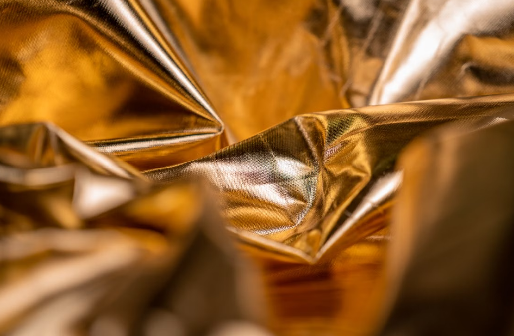 Close-up of crumpled golden metallic texture