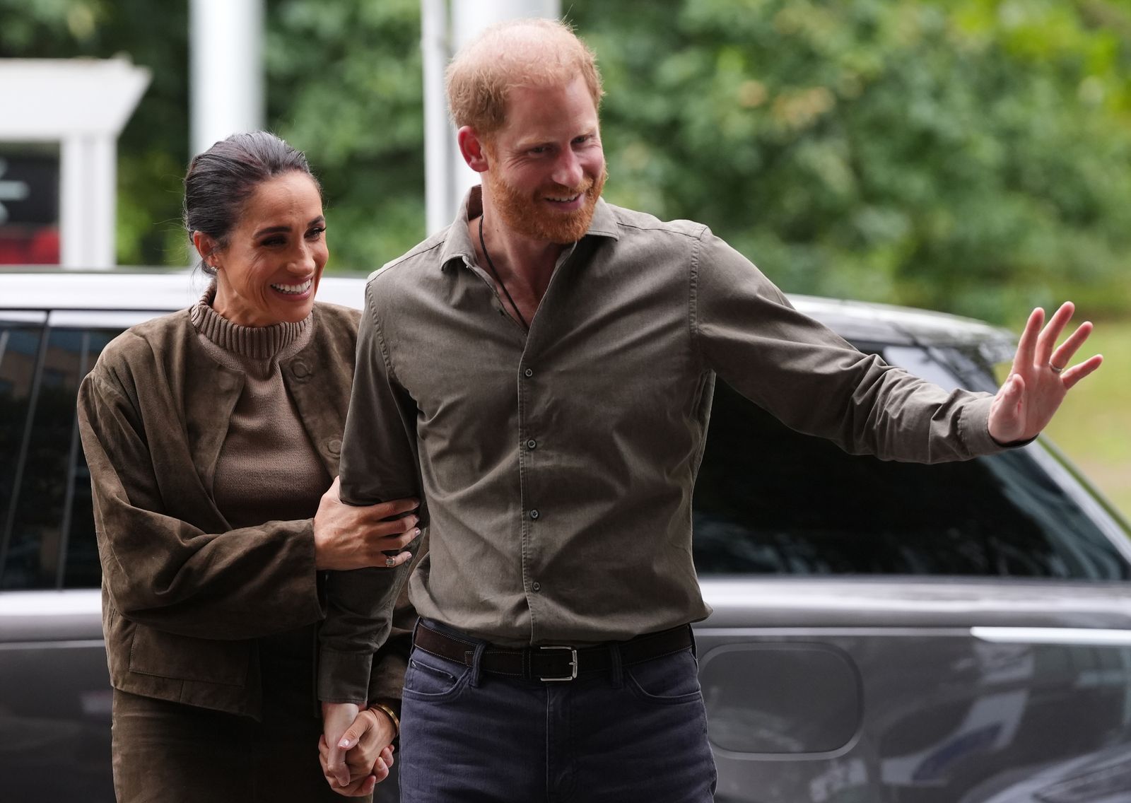Image may contain Prince Harry Duke of Sussex Meghan Duchess of Sussex Adult Person Clothing Shirt Head and Face