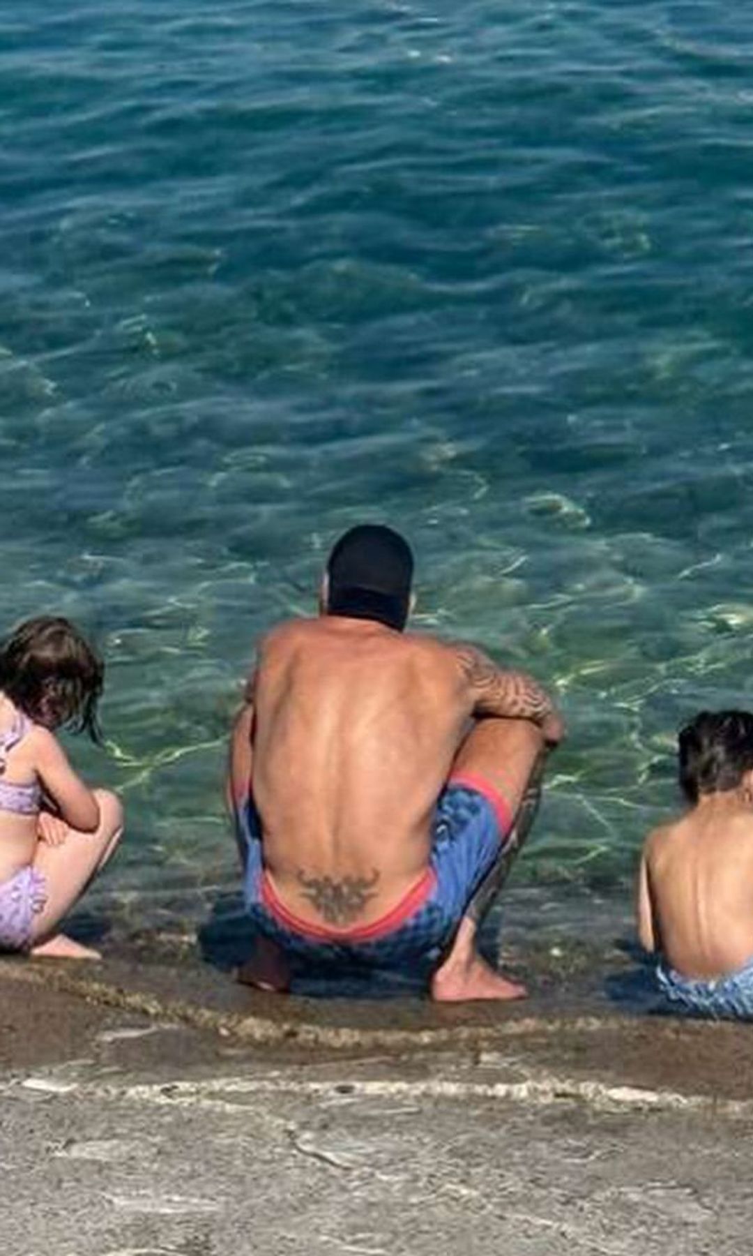 Ricky and his kids hunting for sea shells