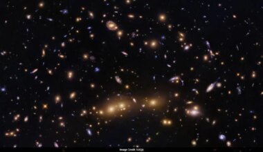 NASA Shares Image Of Merging Galaxy Clusters Helping Decode Dark Matter